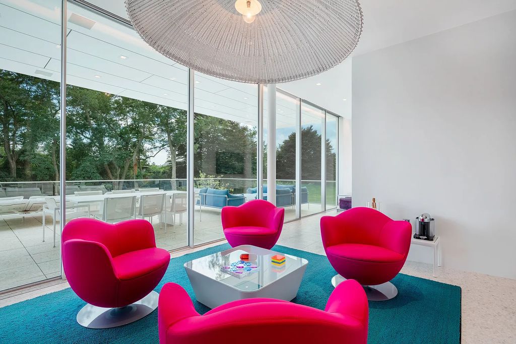 34 Cobb Isle Road, Water Mill, New York is a contemporary architectural masterpiece by renowned architect Roger Ferris overlooking Mecox Bay and the Atlantic Ocean, with 2 docks, plus a fully restored guest house on its own single and separate lot.