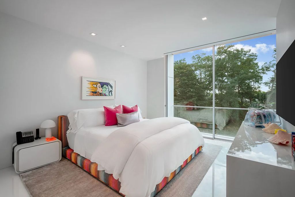 34 Cobb Isle Road, Water Mill, New York is a contemporary architectural masterpiece by renowned architect Roger Ferris overlooking Mecox Bay and the Atlantic Ocean, with 2 docks, plus a fully restored guest house on its own single and separate lot.