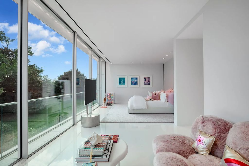 34 Cobb Isle Road, Water Mill, New York is a contemporary architectural masterpiece by renowned architect Roger Ferris overlooking Mecox Bay and the Atlantic Ocean, with 2 docks, plus a fully restored guest house on its own single and separate lot.