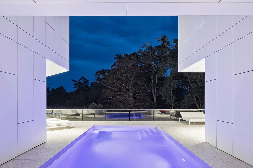 34 Cobb Isle Road, Water Mill, New York is a contemporary architectural masterpiece by renowned architect Roger Ferris overlooking Mecox Bay and the Atlantic Ocean, with 2 docks, plus a fully restored guest house on its own single and separate lot.