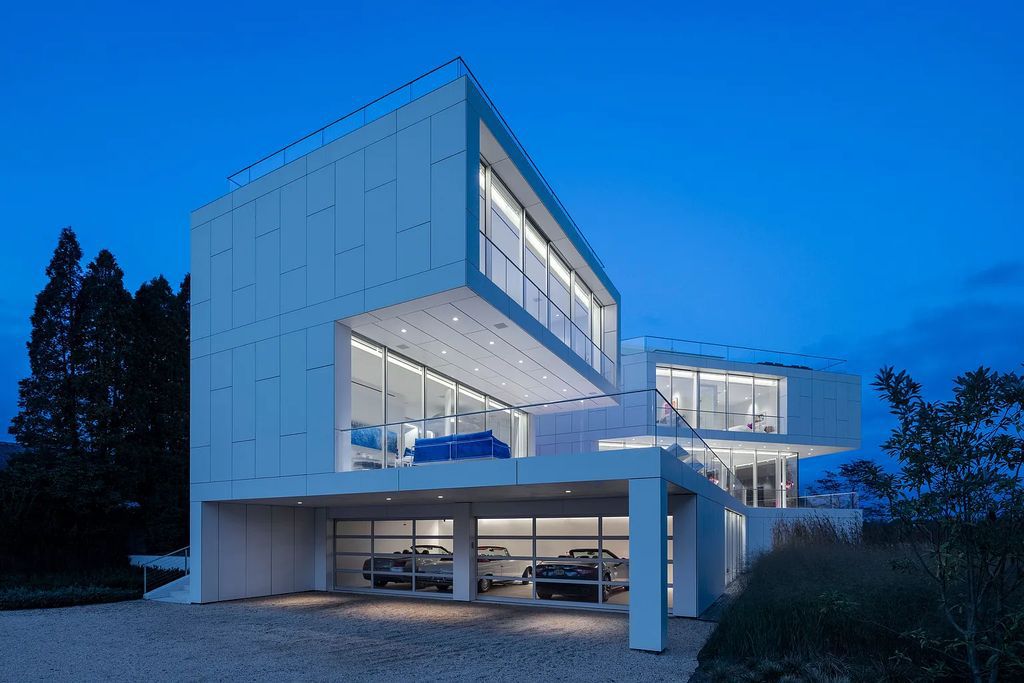 34 Cobb Isle Road, Water Mill, New York is a contemporary architectural masterpiece by renowned architect Roger Ferris overlooking Mecox Bay and the Atlantic Ocean, with 2 docks, plus a fully restored guest house on its own single and separate lot.