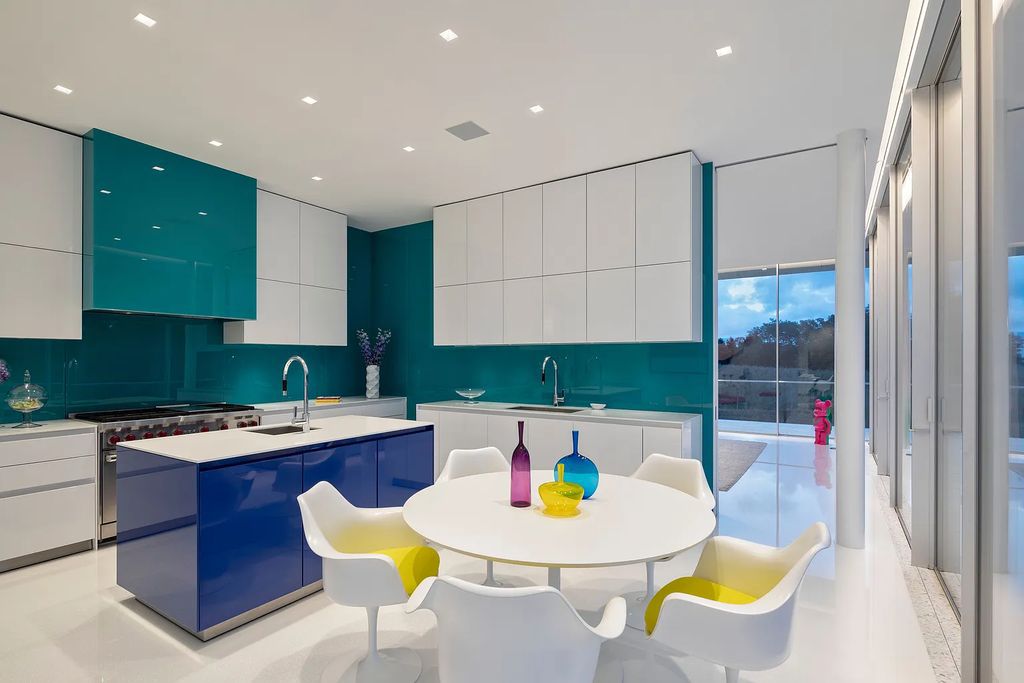 34 Cobb Isle Road, Water Mill, New York is a contemporary architectural masterpiece by renowned architect Roger Ferris overlooking Mecox Bay and the Atlantic Ocean, with 2 docks, plus a fully restored guest house on its own single and separate lot.