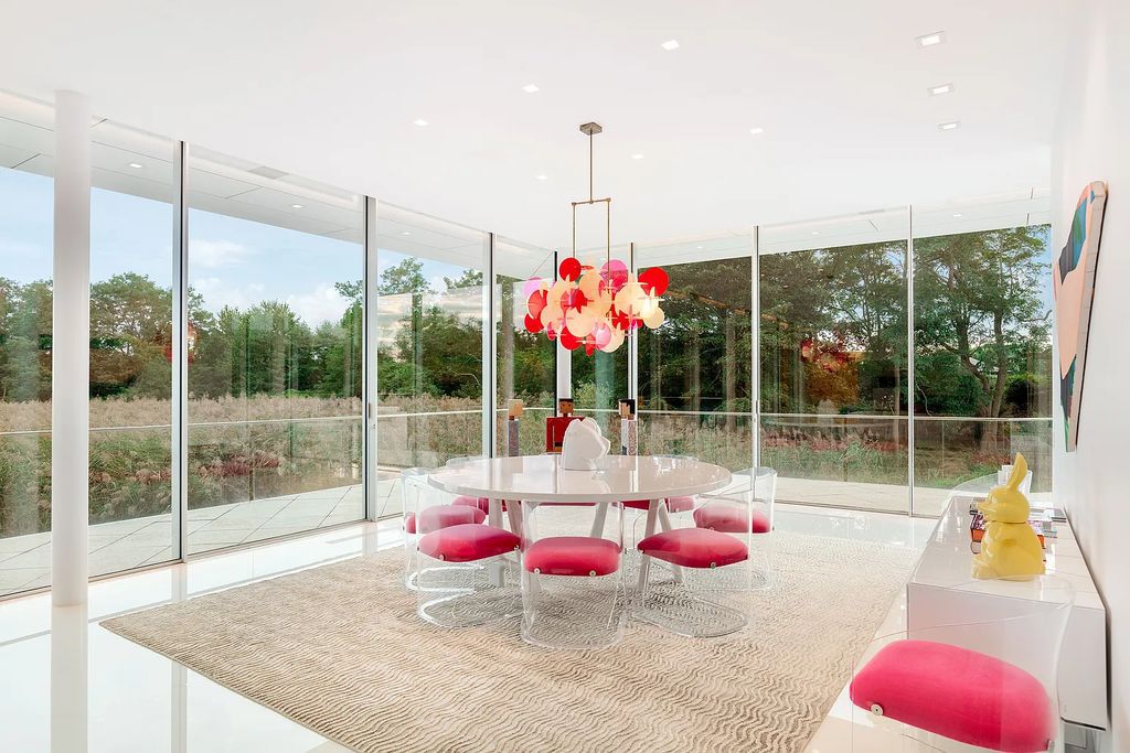34 Cobb Isle Road, Water Mill, New York is a contemporary architectural masterpiece by renowned architect Roger Ferris overlooking Mecox Bay and the Atlantic Ocean, with 2 docks, plus a fully restored guest house on its own single and separate lot.