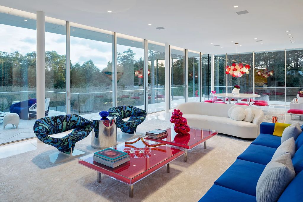 34 Cobb Isle Road, Water Mill, New York is a contemporary architectural masterpiece by renowned architect Roger Ferris overlooking Mecox Bay and the Atlantic Ocean, with 2 docks, plus a fully restored guest house on its own single and separate lot.