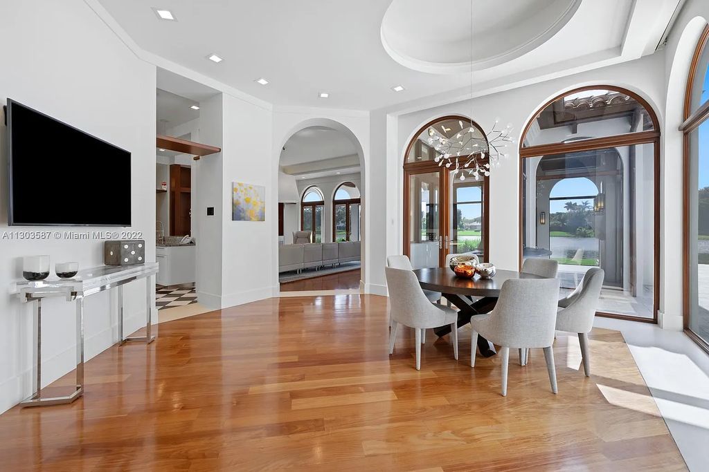 8808 Twin Lake Drive, Boca Raton, Florida is a classic Mediterranean waterfront estate with modern influences located in exclusive gated community of Long Lake Estates situated on 1.1 acres on the best cul-de-sac point lot with southern exposure and 300 ft of waterfrontage.
