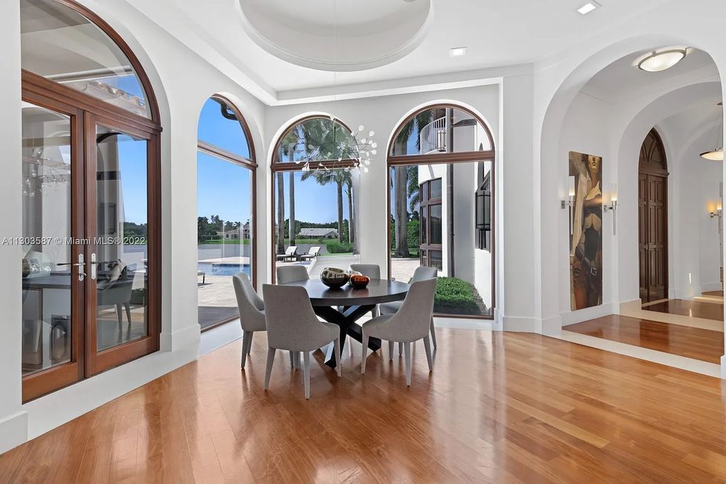 8808 Twin Lake Drive, Boca Raton, Florida is a classic Mediterranean waterfront estate with modern influences located in exclusive gated community of Long Lake Estates situated on 1.1 acres on the best cul-de-sac point lot with southern exposure and 300 ft of waterfrontage.