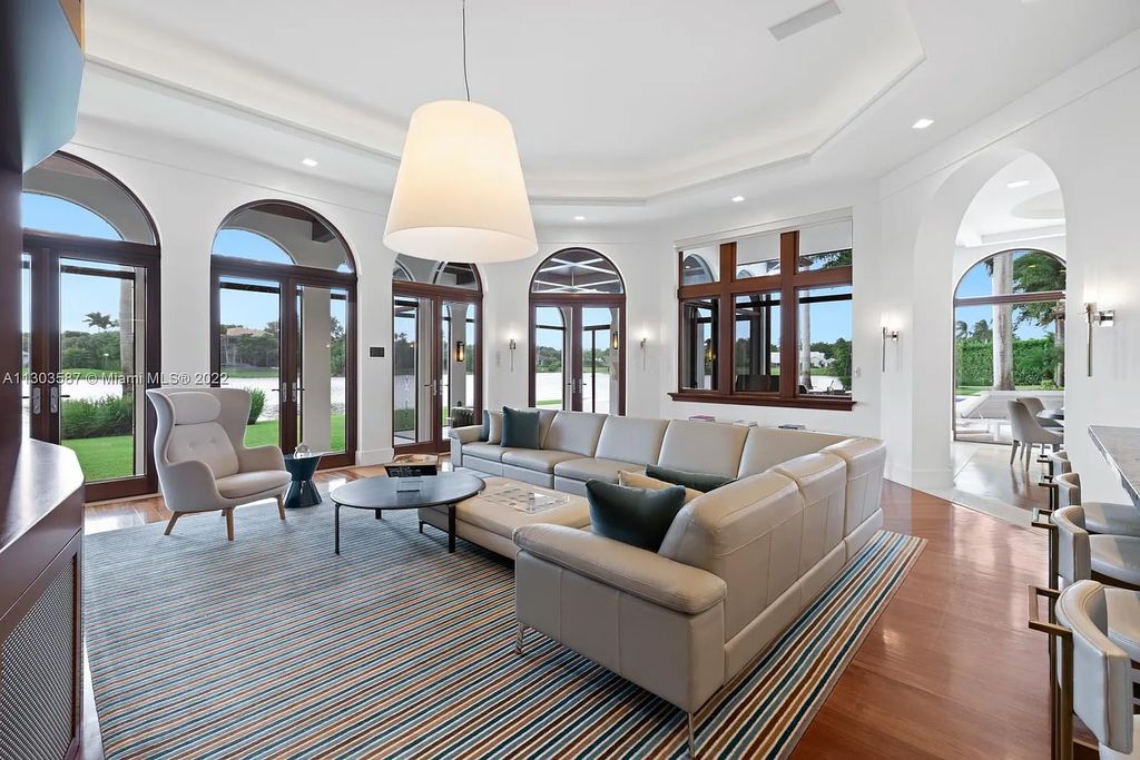 8808 Twin Lake Drive, Boca Raton, Florida is a classic Mediterranean waterfront estate with modern influences located in exclusive gated community of Long Lake Estates situated on 1.1 acres on the best cul-de-sac point lot with southern exposure and 300 ft of waterfrontage.