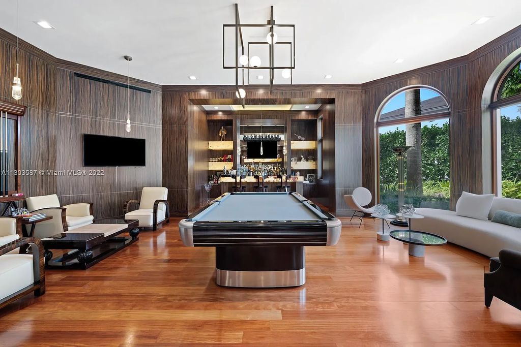 8808 Twin Lake Drive, Boca Raton, Florida is a classic Mediterranean waterfront estate with modern influences located in exclusive gated community of Long Lake Estates situated on 1.1 acres on the best cul-de-sac point lot with southern exposure and 300 ft of waterfrontage.