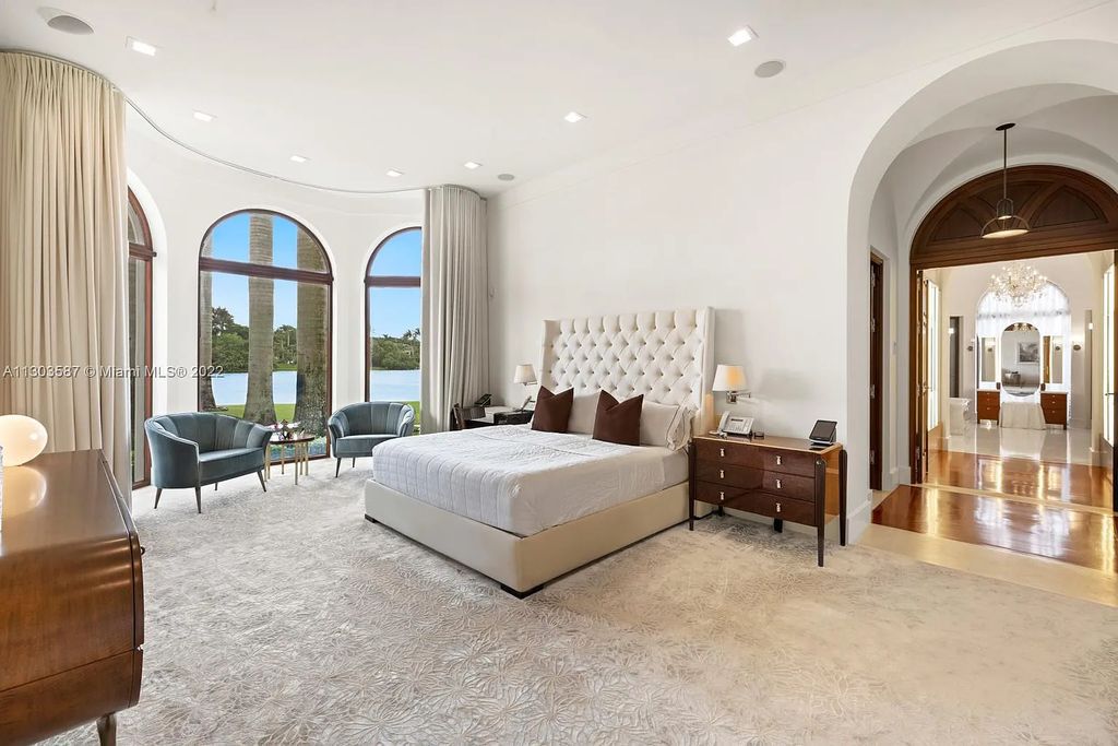 8808 Twin Lake Drive, Boca Raton, Florida is a classic Mediterranean waterfront estate with modern influences located in exclusive gated community of Long Lake Estates situated on 1.1 acres on the best cul-de-sac point lot with southern exposure and 300 ft of waterfrontage.