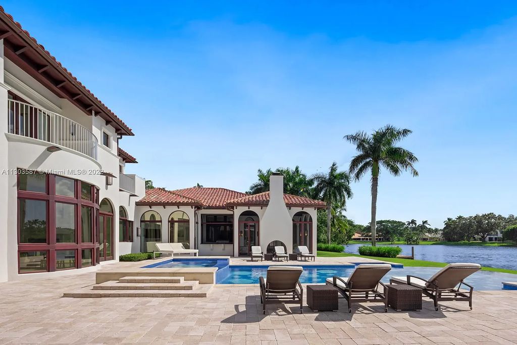 8808 Twin Lake Drive, Boca Raton, Florida is a classic Mediterranean waterfront estate with modern influences located in exclusive gated community of Long Lake Estates situated on 1.1 acres on the best cul-de-sac point lot with southern exposure and 300 ft of waterfrontage.