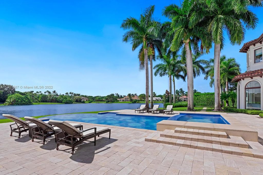 8808 Twin Lake Drive, Boca Raton, Florida is a classic Mediterranean waterfront estate with modern influences located in exclusive gated community of Long Lake Estates situated on 1.1 acres on the best cul-de-sac point lot with southern exposure and 300 ft of waterfrontage.