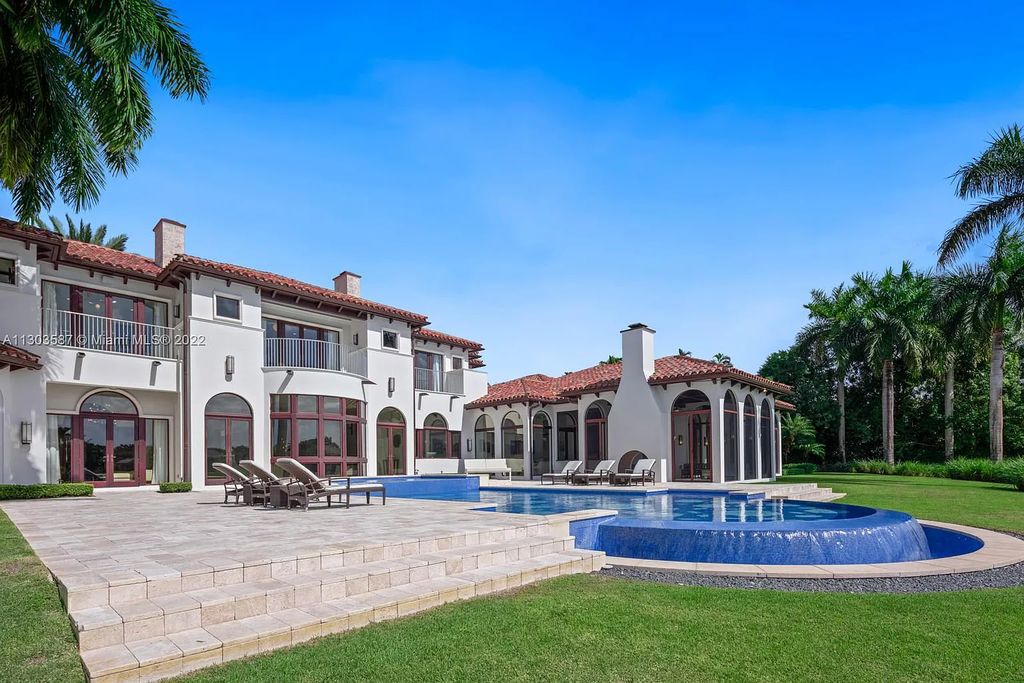 8808 Twin Lake Drive, Boca Raton, Florida is a classic Mediterranean waterfront estate with modern influences located in exclusive gated community of Long Lake Estates situated on 1.1 acres on the best cul-de-sac point lot with southern exposure and 300 ft of waterfrontage.