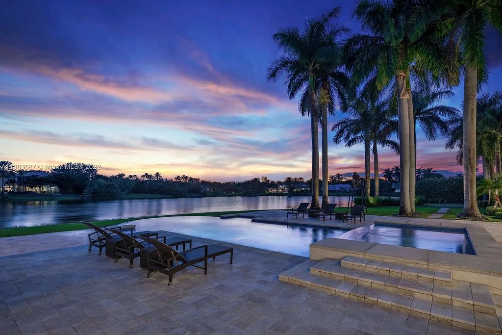 8808 Twin Lake Drive, Boca Raton, Florida is a classic Mediterranean waterfront estate with modern influences located in exclusive gated community of Long Lake Estates situated on 1.1 acres on the best cul-de-sac point lot with southern exposure and 300 ft of waterfrontage.