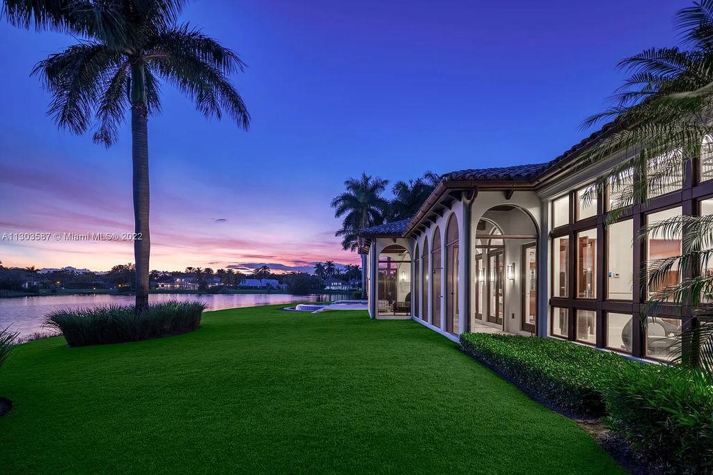 8808 Twin Lake Drive, Boca Raton, Florida is a classic Mediterranean waterfront estate with modern influences located in exclusive gated community of Long Lake Estates situated on 1.1 acres on the best cul-de-sac point lot with southern exposure and 300 ft of waterfrontage.