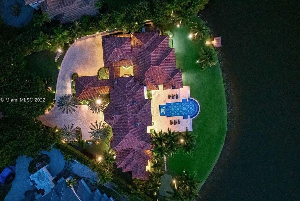 8808 Twin Lake Drive, Boca Raton, Florida is a classic Mediterranean waterfront estate with modern influences located in exclusive gated community of Long Lake Estates situated on 1.1 acres on the best cul-de-sac point lot with southern exposure and 300 ft of waterfrontage.