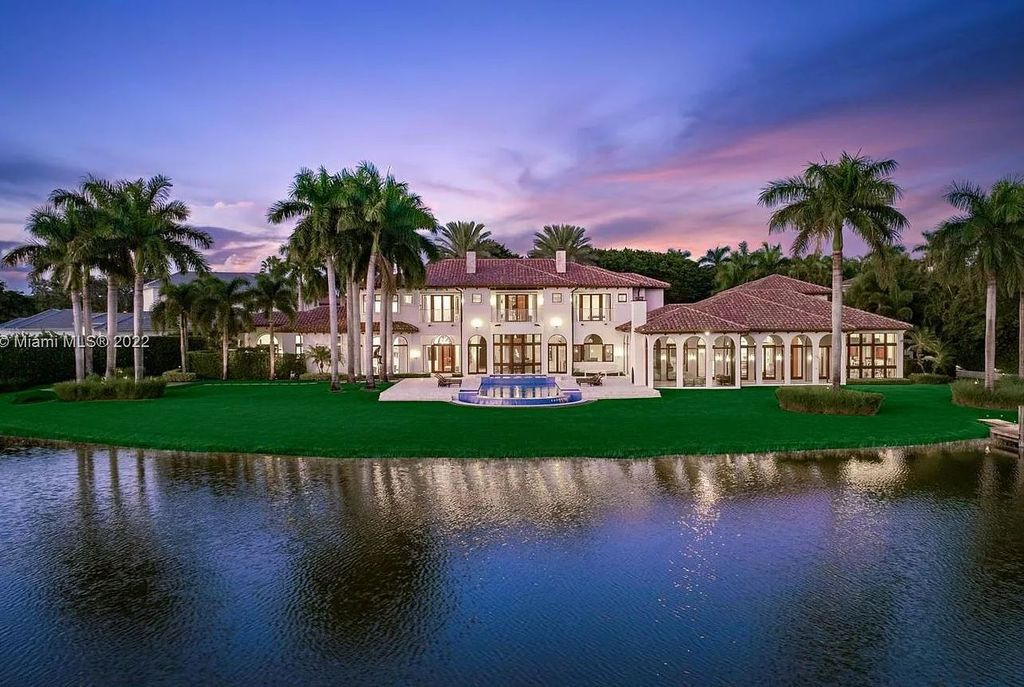 8808 Twin Lake Drive, Boca Raton, Florida is a classic Mediterranean waterfront estate with modern influences located in exclusive gated community of Long Lake Estates situated on 1.1 acres on the best cul-de-sac point lot with southern exposure and 300 ft of waterfrontage.