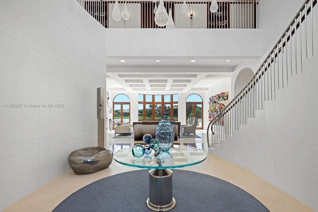 8808 Twin Lake Drive, Boca Raton, Florida is a classic Mediterranean waterfront estate with modern influences located in exclusive gated community of Long Lake Estates situated on 1.1 acres on the best cul-de-sac point lot with southern exposure and 300 ft of waterfrontage.