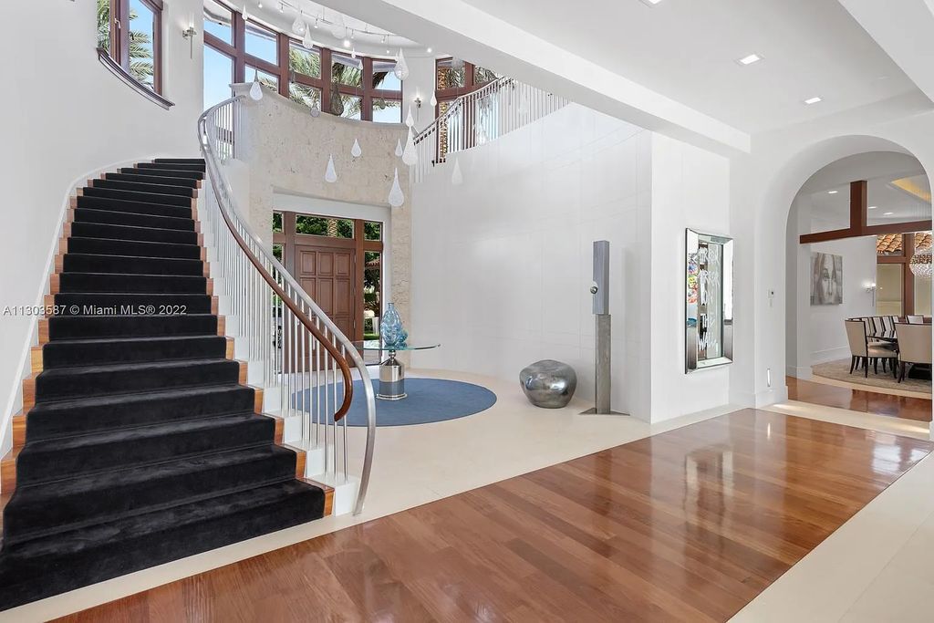 8808 Twin Lake Drive, Boca Raton, Florida is a classic Mediterranean waterfront estate with modern influences located in exclusive gated community of Long Lake Estates situated on 1.1 acres on the best cul-de-sac point lot with southern exposure and 300 ft of waterfrontage.