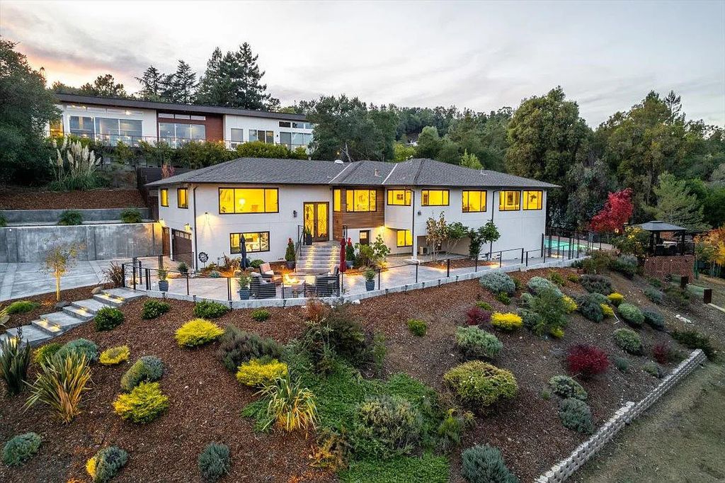 20901 Michaels Drive, Saratoga, California is a modern East facing home with divine sunrise views, city light night views sitting on a peaceful, quiet, location full of nature and still close to town; restaurants, parks, library, schools & more. 