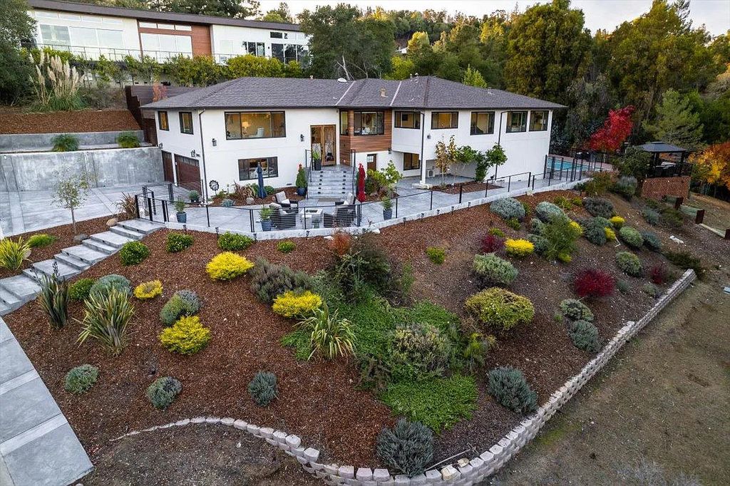 20901 Michaels Drive, Saratoga, California is a modern East facing home with divine sunrise views, city light night views sitting on a peaceful, quiet, location full of nature and still close to town; restaurants, parks, library, schools & more. 