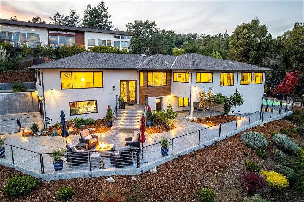 20901 Michaels Drive, Saratoga, California is a modern East facing home with divine sunrise views, city light night views sitting on a peaceful, quiet, location full of nature and still close to town; restaurants, parks, library, schools & more. 