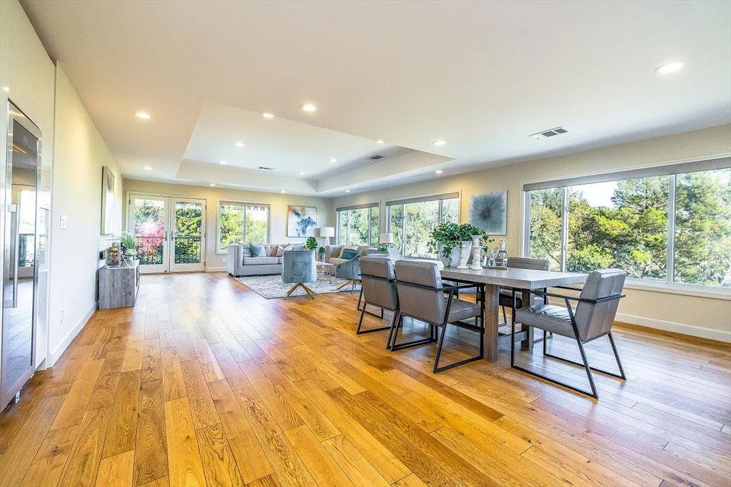 20901 Michaels Drive, Saratoga, California is a modern East facing home with divine sunrise views, city light night views sitting on a peaceful, quiet, location full of nature and still close to town; restaurants, parks, library, schools & more. 