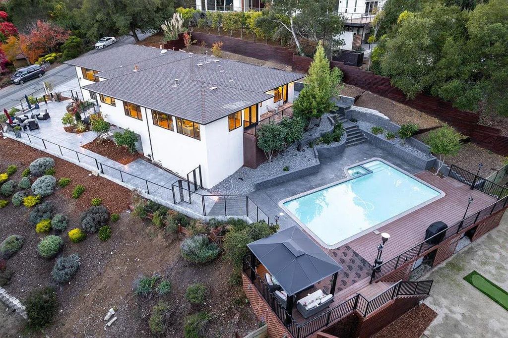 20901 Michaels Drive, Saratoga, California is a modern East facing home with divine sunrise views, city light night views sitting on a peaceful, quiet, location full of nature and still close to town; restaurants, parks, library, schools & more. 