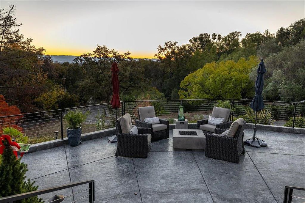 20901 Michaels Drive, Saratoga, California is a modern East facing home with divine sunrise views, city light night views sitting on a peaceful, quiet, location full of nature and still close to town; restaurants, parks, library, schools & more. 