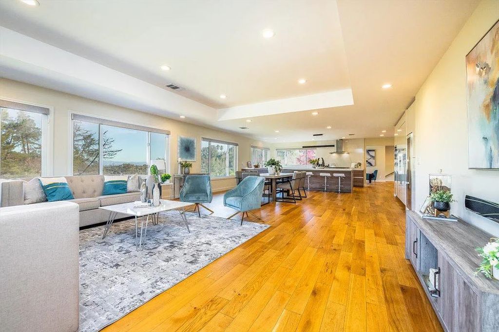 20901 Michaels Drive, Saratoga, California is a modern East facing home with divine sunrise views, city light night views sitting on a peaceful, quiet, location full of nature and still close to town; restaurants, parks, library, schools & more. 