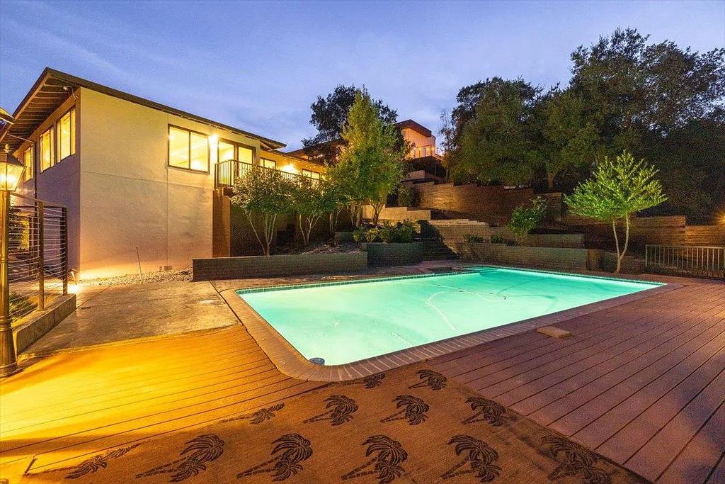 20901 Michaels Drive, Saratoga, California is a modern East facing home with divine sunrise views, city light night views sitting on a peaceful, quiet, location full of nature and still close to town; restaurants, parks, library, schools & more. 