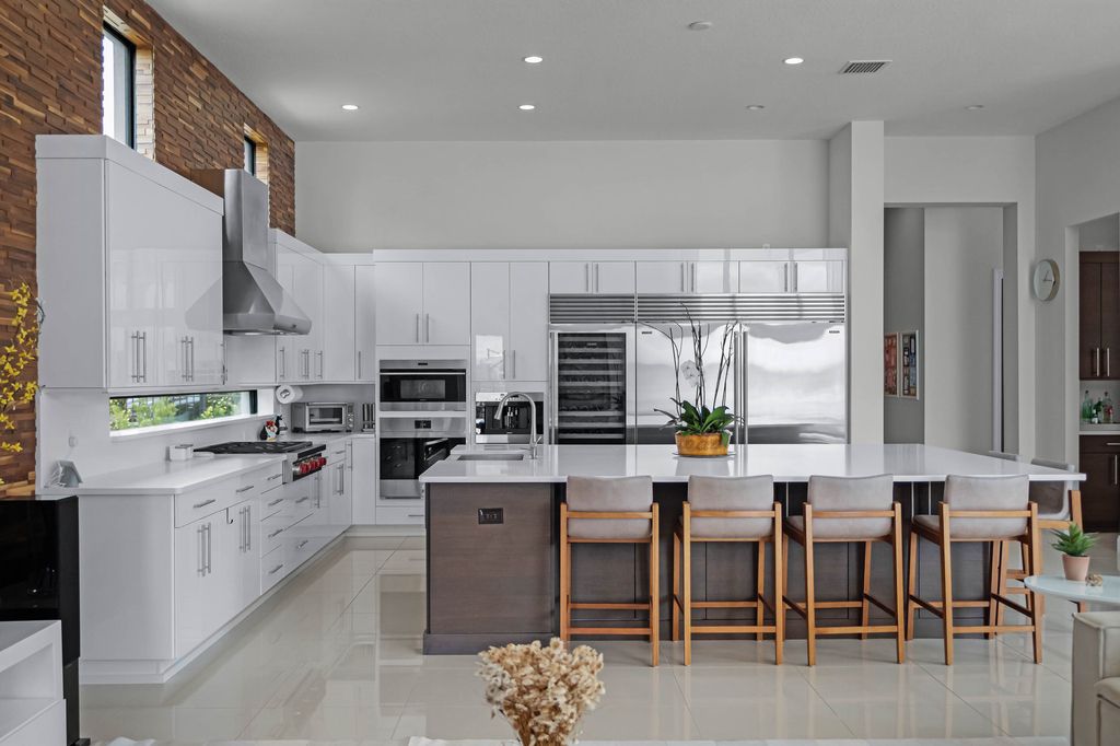4066 Isabella Circle, Windermere, Florida is a spectacular home with beautiful porcelain floors, high-end appliances, accent wall, expensive light features, and an amazing backyard and gorgeous views.