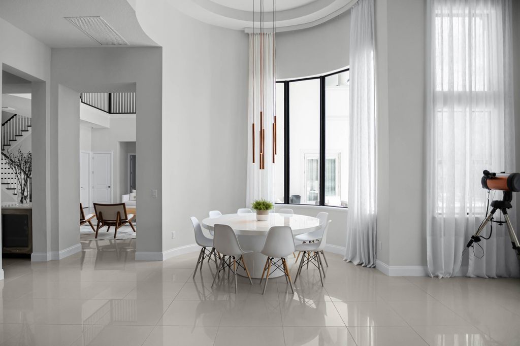 4066 Isabella Circle, Windermere, Florida is a spectacular home with beautiful porcelain floors, high-end appliances, accent wall, expensive light features, and an amazing backyard and gorgeous views.