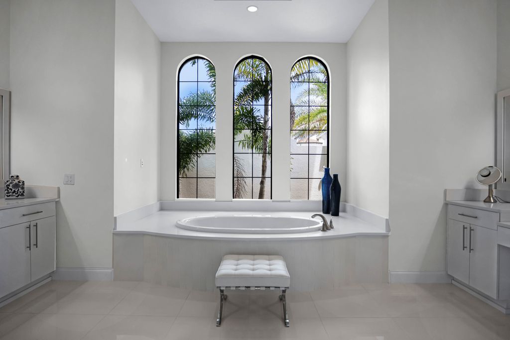 4066 Isabella Circle, Windermere, Florida is a spectacular home with beautiful porcelain floors, high-end appliances, accent wall, expensive light features, and an amazing backyard and gorgeous views.