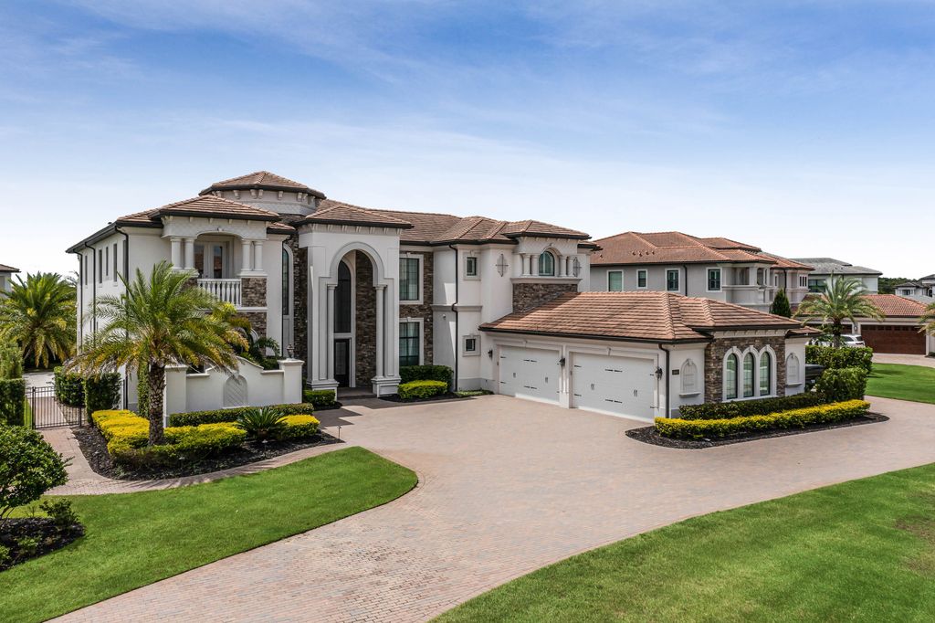 4066 Isabella Circle, Windermere, Florida is a spectacular home with beautiful porcelain floors, high-end appliances, accent wall, expensive light features, and an amazing backyard and gorgeous views.