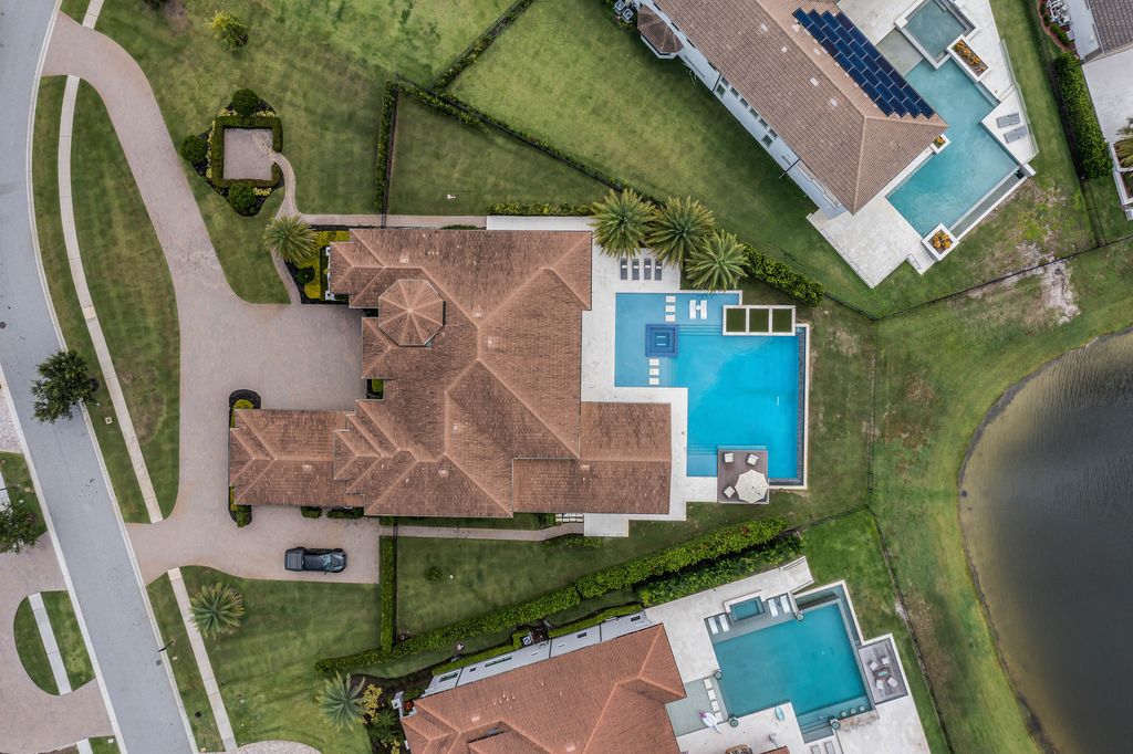 4066 Isabella Circle, Windermere, Florida is a spectacular home with beautiful porcelain floors, high-end appliances, accent wall, expensive light features, and an amazing backyard and gorgeous views.