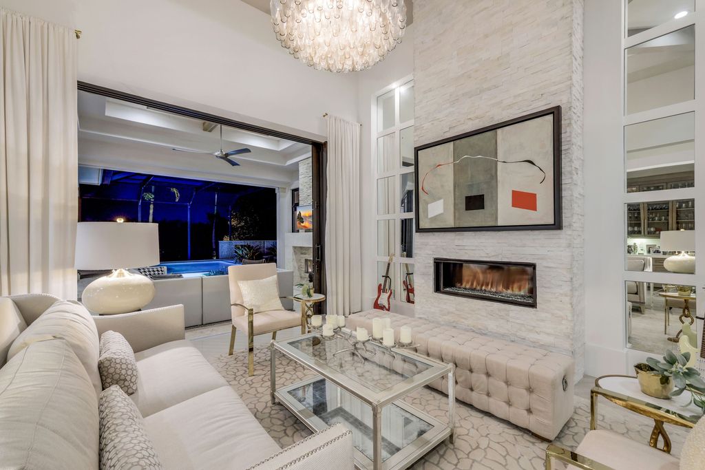 26171 Woodlyn Drive, Bonita Springs, Florida is a contemporary masterpiece with every detail considered for style and comfort, Luxury features include honed porcelain tile, whitewashed oak flooring, state of the art kitchen, stunning wet bar & fireplace, outdoor kitchen, custom pool, outdoor fireplace, and much more.