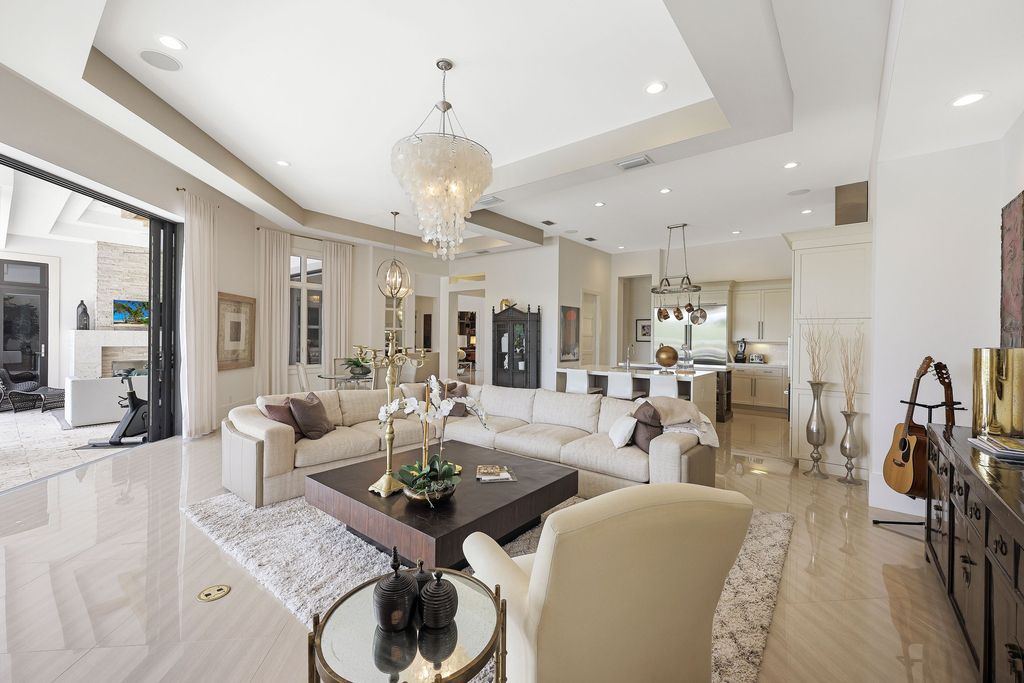 26171 Woodlyn Drive, Bonita Springs, Florida is a contemporary masterpiece with every detail considered for style and comfort, Luxury features include honed porcelain tile, whitewashed oak flooring, state of the art kitchen, stunning wet bar & fireplace, outdoor kitchen, custom pool, outdoor fireplace, and much more.