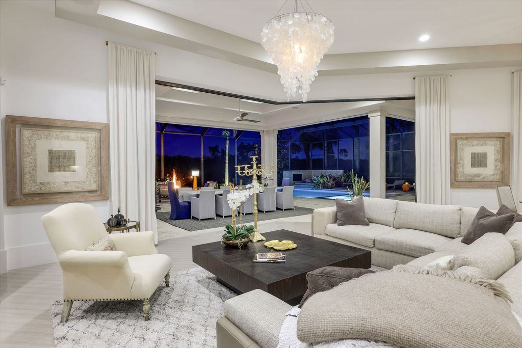 26171 Woodlyn Drive, Bonita Springs, Florida is a contemporary masterpiece with every detail considered for style and comfort, Luxury features include honed porcelain tile, whitewashed oak flooring, state of the art kitchen, stunning wet bar & fireplace, outdoor kitchen, custom pool, outdoor fireplace, and much more.