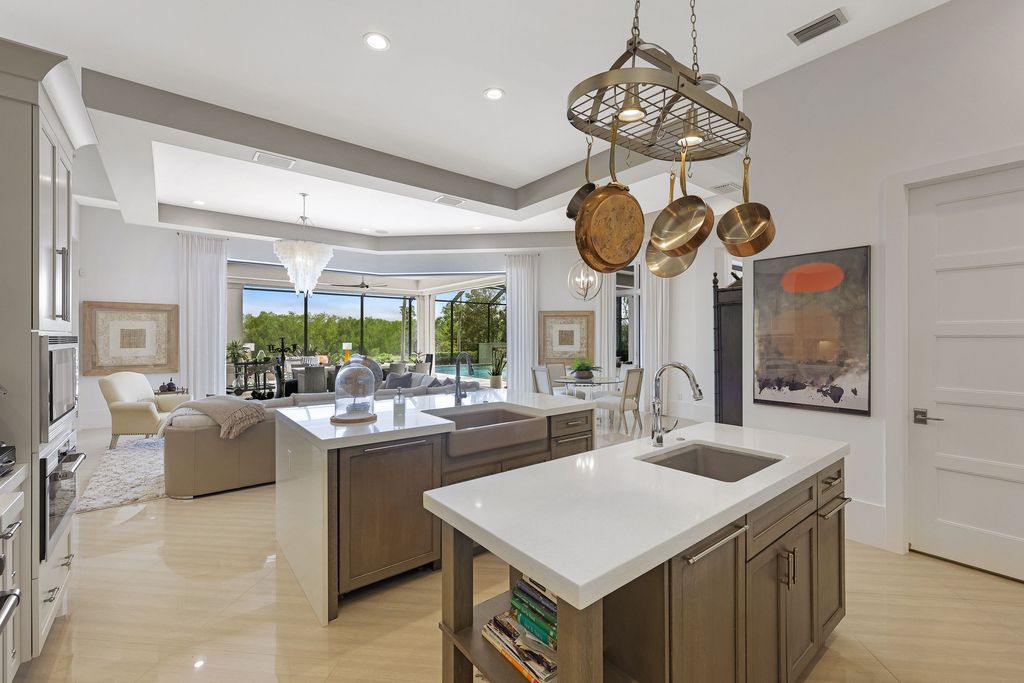 26171 Woodlyn Drive, Bonita Springs, Florida is a contemporary masterpiece with every detail considered for style and comfort, Luxury features include honed porcelain tile, whitewashed oak flooring, state of the art kitchen, stunning wet bar & fireplace, outdoor kitchen, custom pool, outdoor fireplace, and much more.