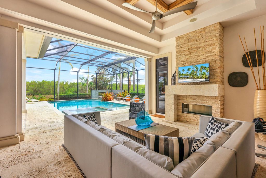 26171 Woodlyn Drive, Bonita Springs, Florida is a contemporary masterpiece with every detail considered for style and comfort, Luxury features include honed porcelain tile, whitewashed oak flooring, state of the art kitchen, stunning wet bar & fireplace, outdoor kitchen, custom pool, outdoor fireplace, and much more.