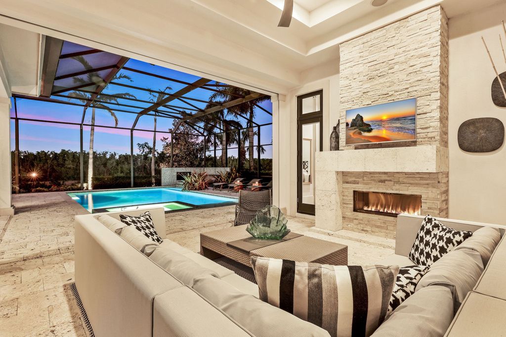 26171 Woodlyn Drive, Bonita Springs, Florida is a contemporary masterpiece with every detail considered for style and comfort, Luxury features include honed porcelain tile, whitewashed oak flooring, state of the art kitchen, stunning wet bar & fireplace, outdoor kitchen, custom pool, outdoor fireplace, and much more.
