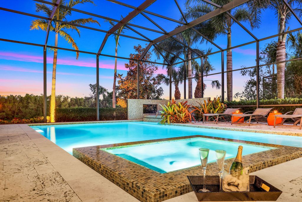 26171 Woodlyn Drive, Bonita Springs, Florida is a contemporary masterpiece with every detail considered for style and comfort, Luxury features include honed porcelain tile, whitewashed oak flooring, state of the art kitchen, stunning wet bar & fireplace, outdoor kitchen, custom pool, outdoor fireplace, and much more.