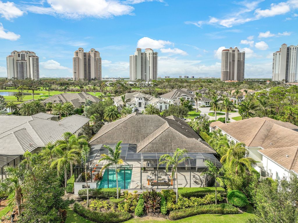 26171 Woodlyn Drive, Bonita Springs, Florida is a contemporary masterpiece with every detail considered for style and comfort, Luxury features include honed porcelain tile, whitewashed oak flooring, state of the art kitchen, stunning wet bar & fireplace, outdoor kitchen, custom pool, outdoor fireplace, and much more.