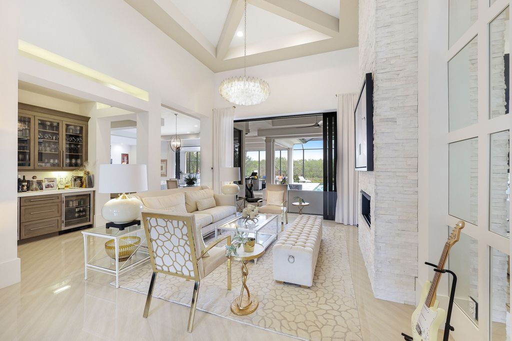 26171 Woodlyn Drive, Bonita Springs, Florida is a contemporary masterpiece with every detail considered for style and comfort, Luxury features include honed porcelain tile, whitewashed oak flooring, state of the art kitchen, stunning wet bar & fireplace, outdoor kitchen, custom pool, outdoor fireplace, and much more.