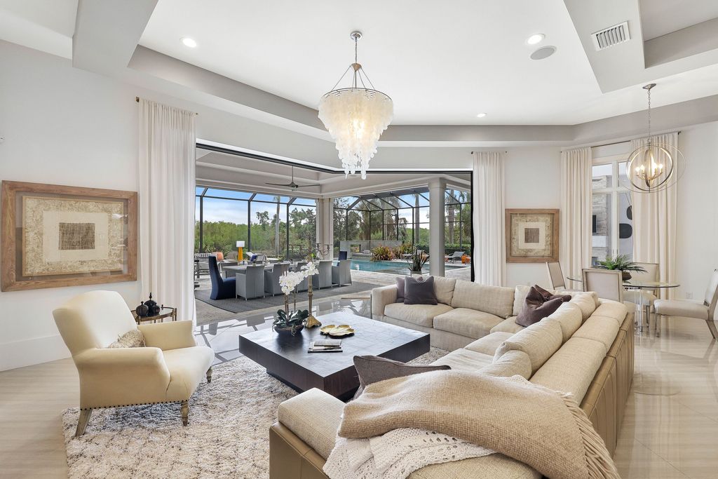 26171 Woodlyn Drive, Bonita Springs, Florida is a contemporary masterpiece with every detail considered for style and comfort, Luxury features include honed porcelain tile, whitewashed oak flooring, state of the art kitchen, stunning wet bar & fireplace, outdoor kitchen, custom pool, outdoor fireplace, and much more.