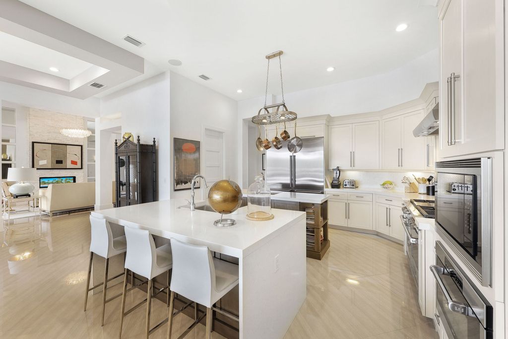 26171 Woodlyn Drive, Bonita Springs, Florida is a contemporary masterpiece with every detail considered for style and comfort, Luxury features include honed porcelain tile, whitewashed oak flooring, state of the art kitchen, stunning wet bar & fireplace, outdoor kitchen, custom pool, outdoor fireplace, and much more.