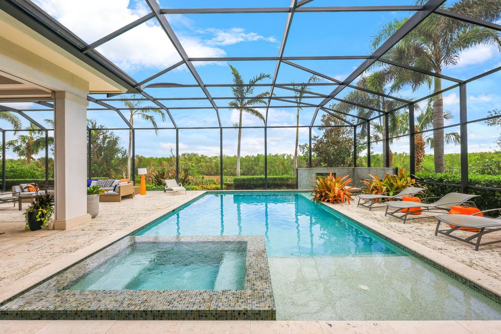 26171 Woodlyn Drive, Bonita Springs, Florida is a contemporary masterpiece with every detail considered for style and comfort, Luxury features include honed porcelain tile, whitewashed oak flooring, state of the art kitchen, stunning wet bar & fireplace, outdoor kitchen, custom pool, outdoor fireplace, and much more.
