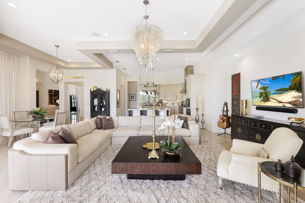 26171 Woodlyn Drive, Bonita Springs, Florida is a contemporary masterpiece with every detail considered for style and comfort, Luxury features include honed porcelain tile, whitewashed oak flooring, state of the art kitchen, stunning wet bar & fireplace, outdoor kitchen, custom pool, outdoor fireplace, and much more.