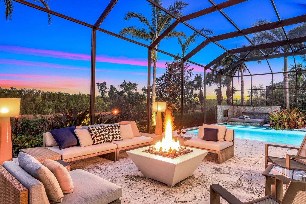 26171 Woodlyn Drive, Bonita Springs, Florida is a contemporary masterpiece with every detail considered for style and comfort, Luxury features include honed porcelain tile, whitewashed oak flooring, state of the art kitchen, stunning wet bar & fireplace, outdoor kitchen, custom pool, outdoor fireplace, and much more.