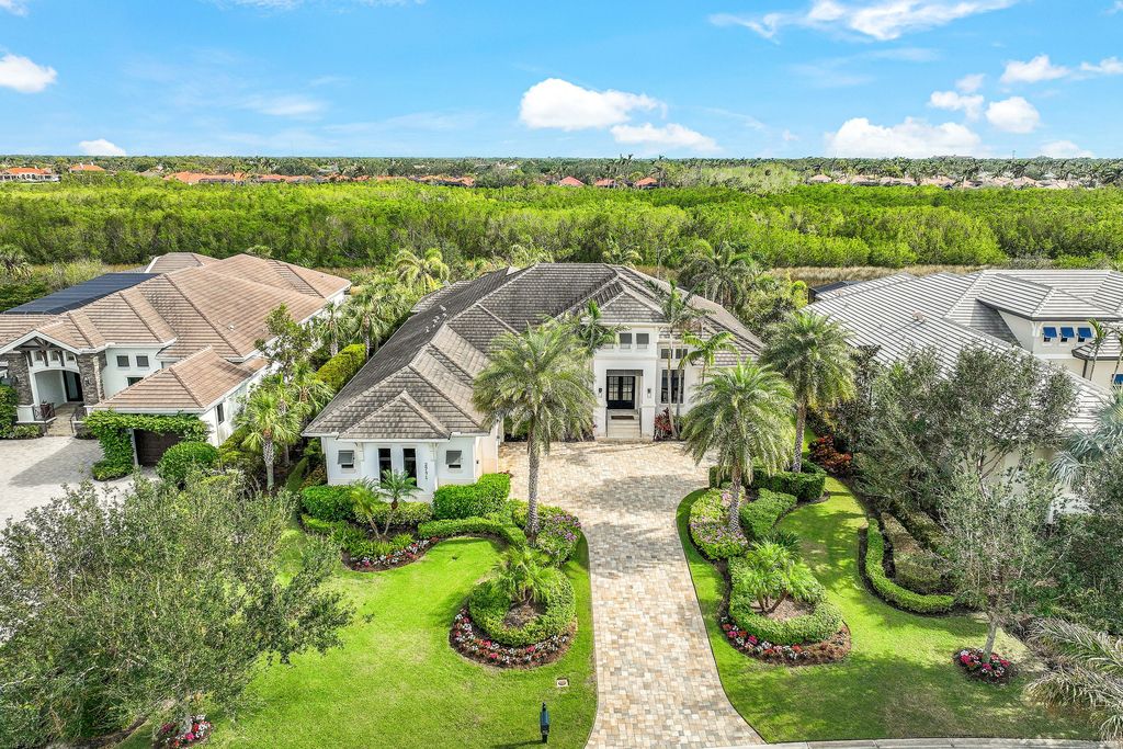 26171 Woodlyn Drive, Bonita Springs, Florida is a contemporary masterpiece with every detail considered for style and comfort, Luxury features include honed porcelain tile, whitewashed oak flooring, state of the art kitchen, stunning wet bar & fireplace, outdoor kitchen, custom pool, outdoor fireplace, and much more.